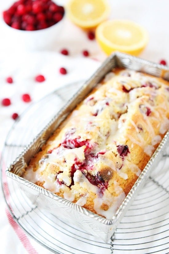 Orange Cranberry Bread Recipe on twopeasandtheirpod.com Sweet orange bread dotted with cranberries and drizzled with an orange glaze! This bread is perfect for the holidays! Orange Cranberry Bread Recipe on twopeasandtheirpod.com