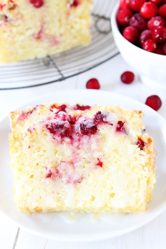 Orange Cranberry Bread Recipe on twopeasandtheirpod.com Sweet orange bread dotted with cranberries and drizzled with an orange glaze! This bread is perfect for holiday parties, meals, and makes a great gift too! Orange Cranberry Bread Recipe on twopeasandtheirpod.com