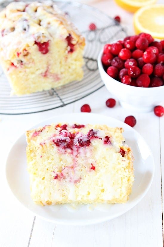 Orange Cranberry Bread Recipe on twopeasandtheirpod.com Sweet orange bread dotted with cranberries and drizzled with an orange glaze! This bread is perfect for Christmas brunch, dessert, and it makes a great gift! Cranberry Orange Bread Recipe