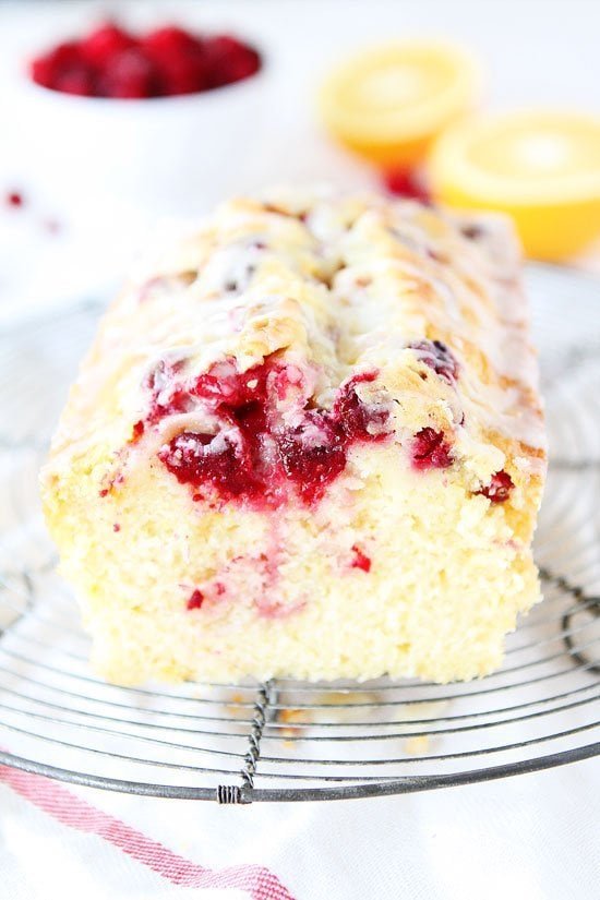 Orange Cranberry Bread Recipe on twopeasandtheirpod.com Sweet orange bread dotted with cranberries and drizzled with an orange glaze! This bread is perfect for the holidays and it makes a great gift too! Cranberry Orange Bread Recipe