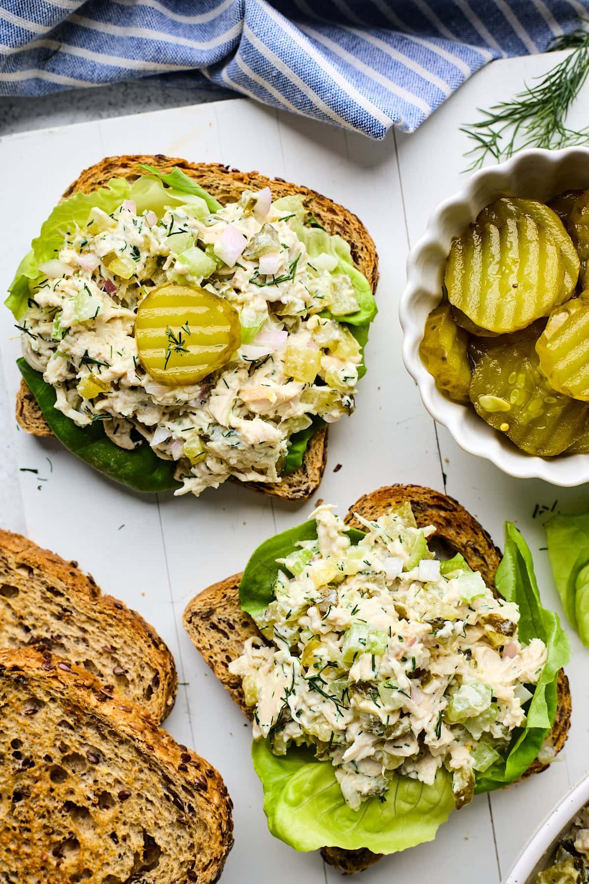 dill pickle chicken salad on bread with lettuce.