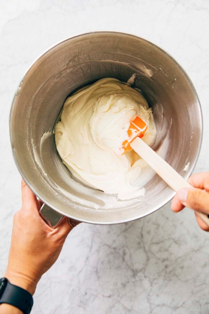 photo of stand mixer bowl with white almond cake batter