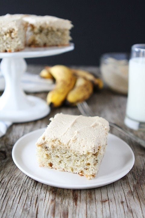 Banana Cake with Peanut Butter Frosting Recipe on twopeasandtheirpod.com Love this easy cake recipe! Easy banana cake recipe to use old bananas