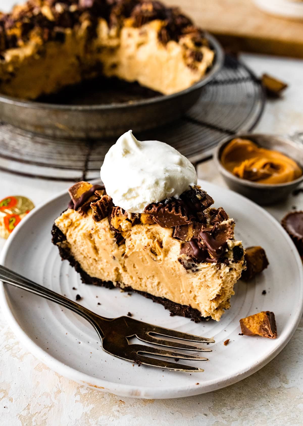 piece of peanut butter pie on plate with fork.