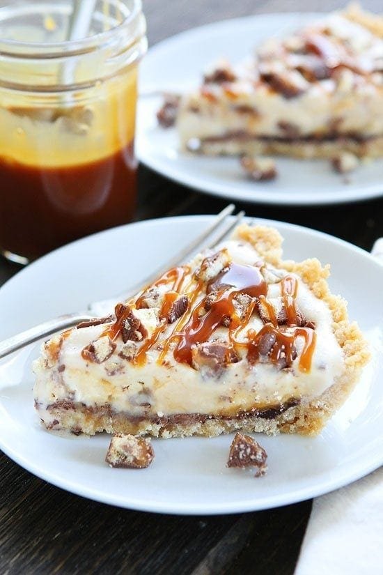 Twix Ice Cream Pie Recipe on twopeasandtheirpod.com Shortbread cookie crust with a layer of chocolate, vanilla ice cream, chopped Twix candy bars, and salted caramel sauce. Twix Ice Cream Pie