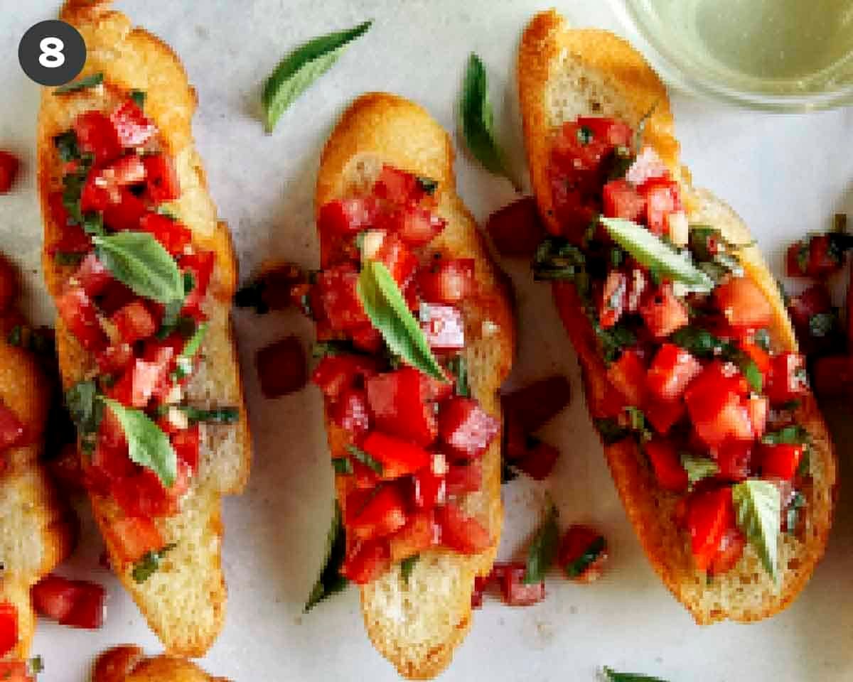 Bruschetta recipe on crostini with basil. 