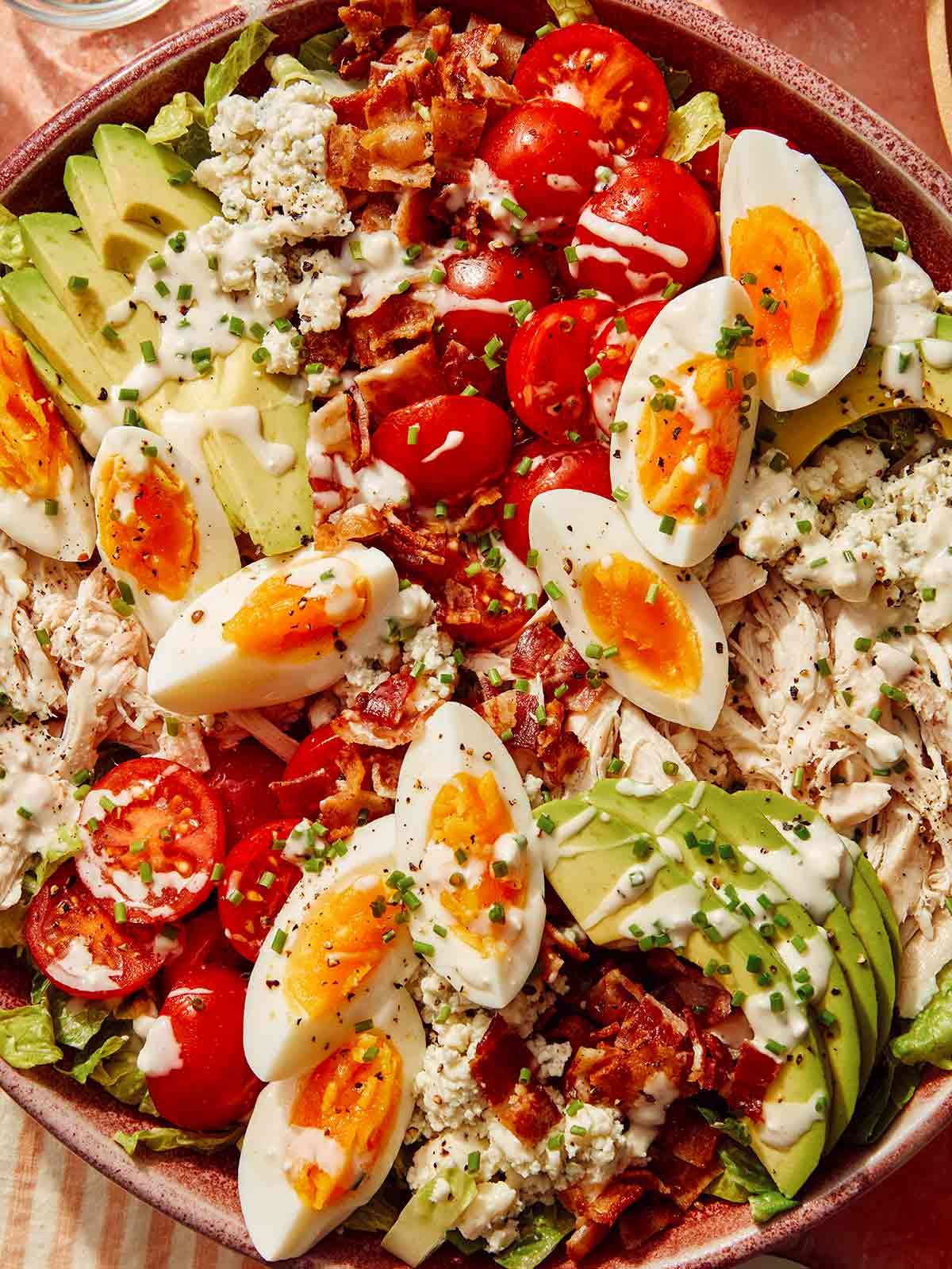 A bowl of cobb salad up close.