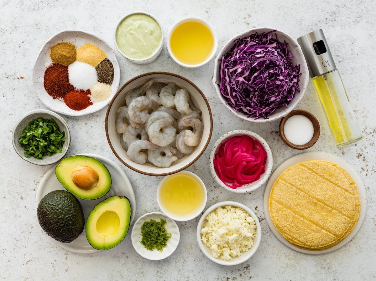 ingredients in bowls to make shrimp tostadas.