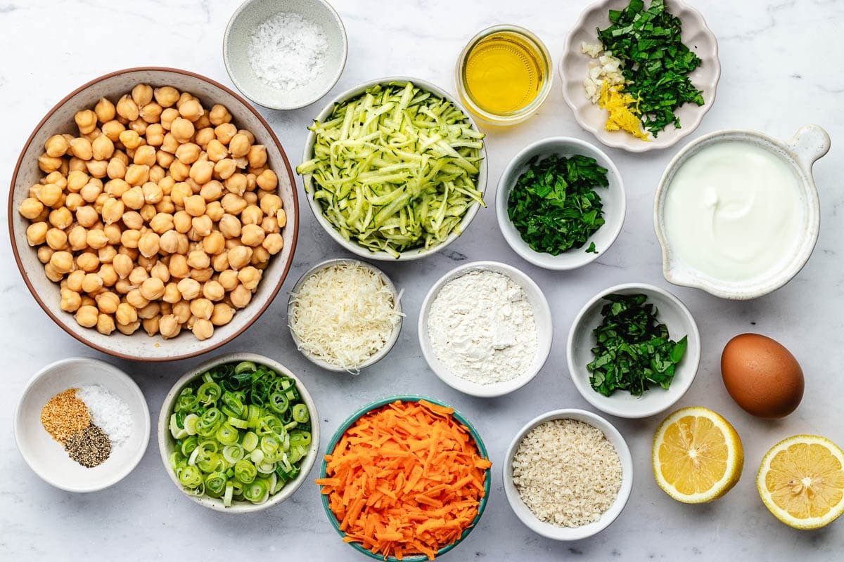 ingredients in bowls to make vegetable chickpea fritters. 