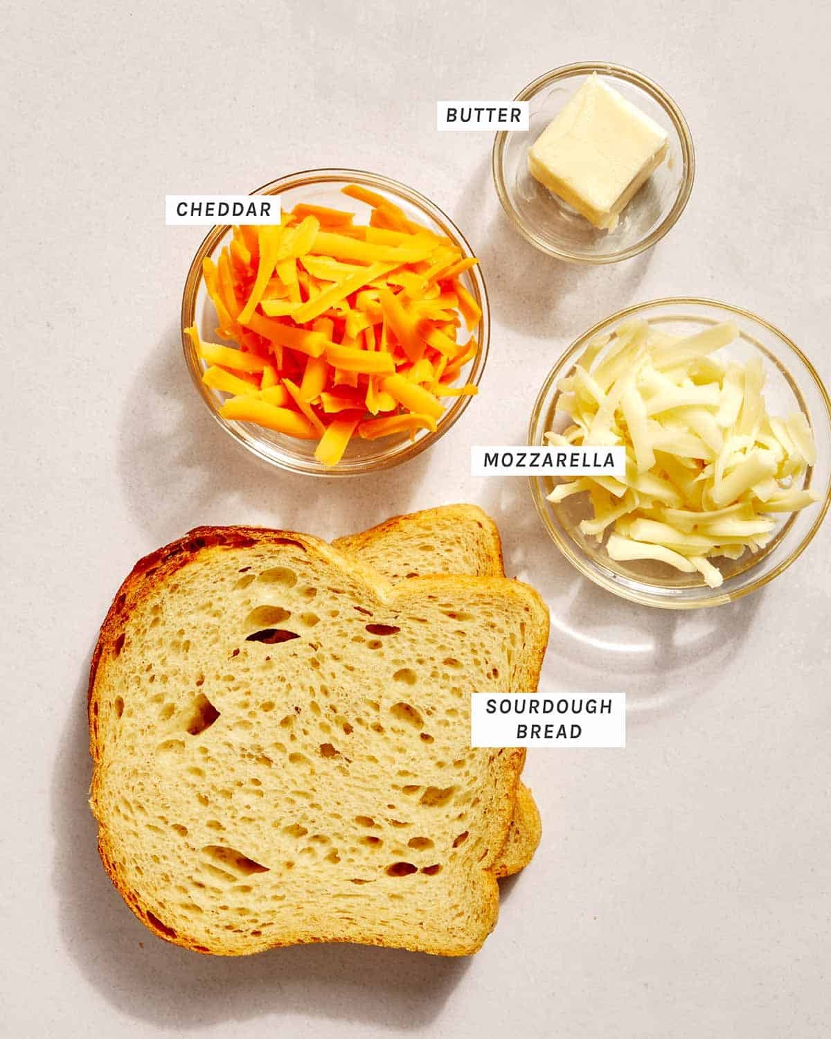 Perfect grilled cheese recipe ingredients on a kitchen counter.