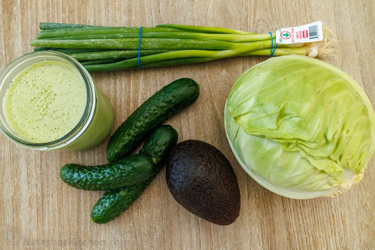 ingredients for Green Goddess Salad using Green goddess dressing, green onions, cucumbers, avocado and lettuce