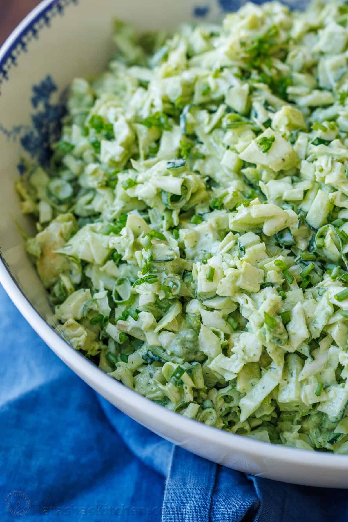 Chopped cabbage in a bowl with homemade dressing