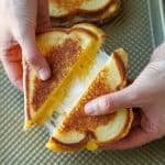 Grilled cheese from the oven cut in half and pulled apart