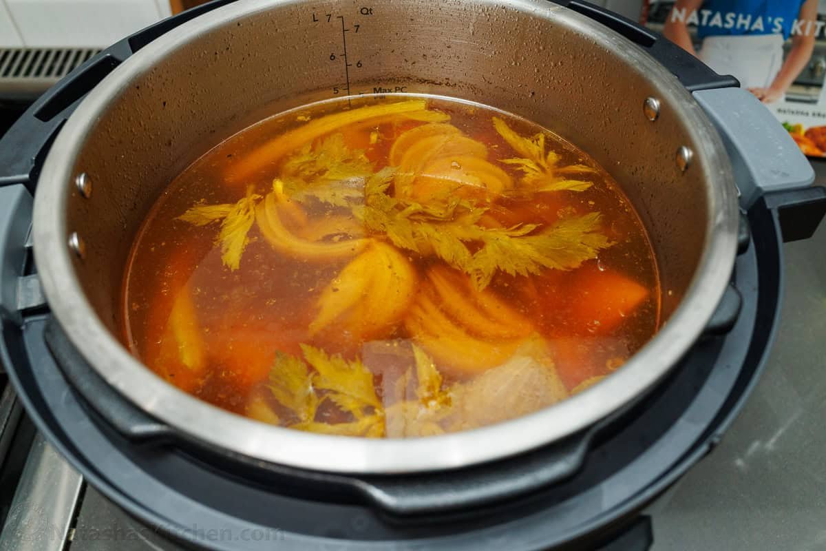 Cooked beef stock in a pot