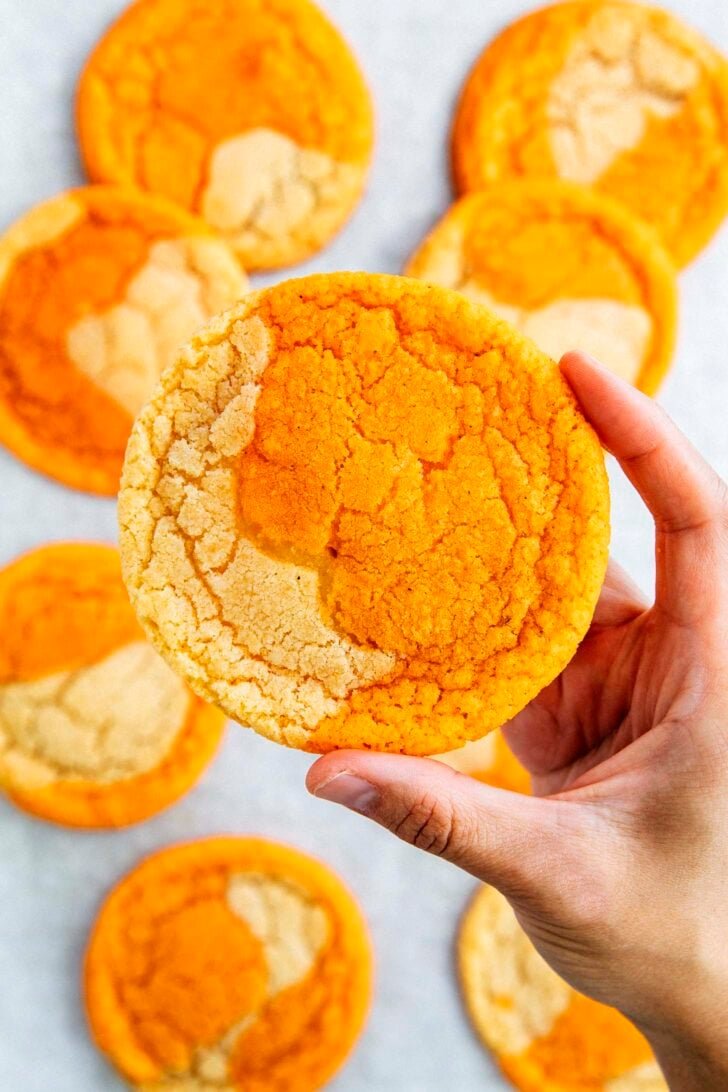 photo of michelle from hummingbird high holding up a thai tea cookie