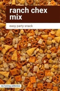 Close up of ranch chex mix spread into a layer on a sheet pan. Text overlay includes recipe name.