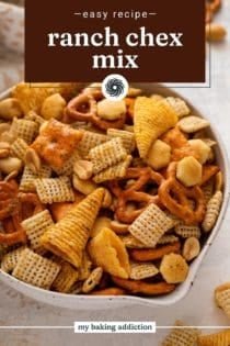 Close up of ranch chex mix in a bowl. Text overlay includes recipe name.