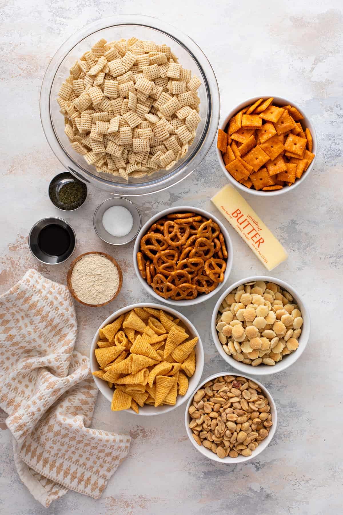 ranch chex mix ingredients arranged on a countertop.