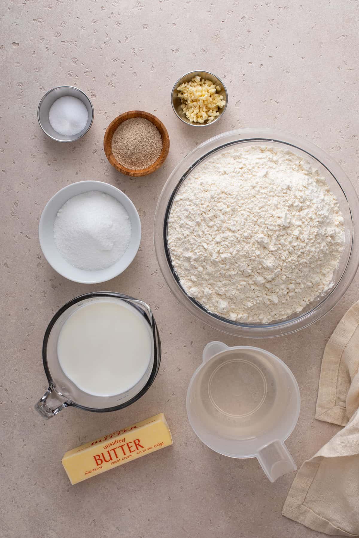 Ingredients for brown and serve rolls arranged on a countertop.