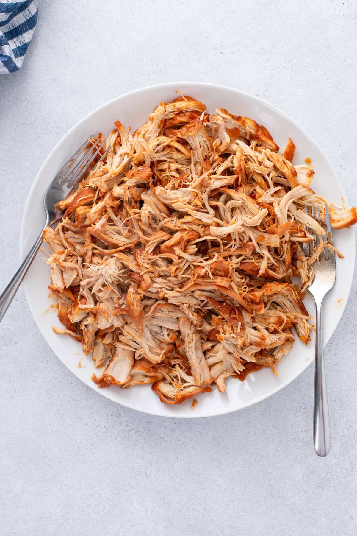 Shredded cooked cranberry chicken.