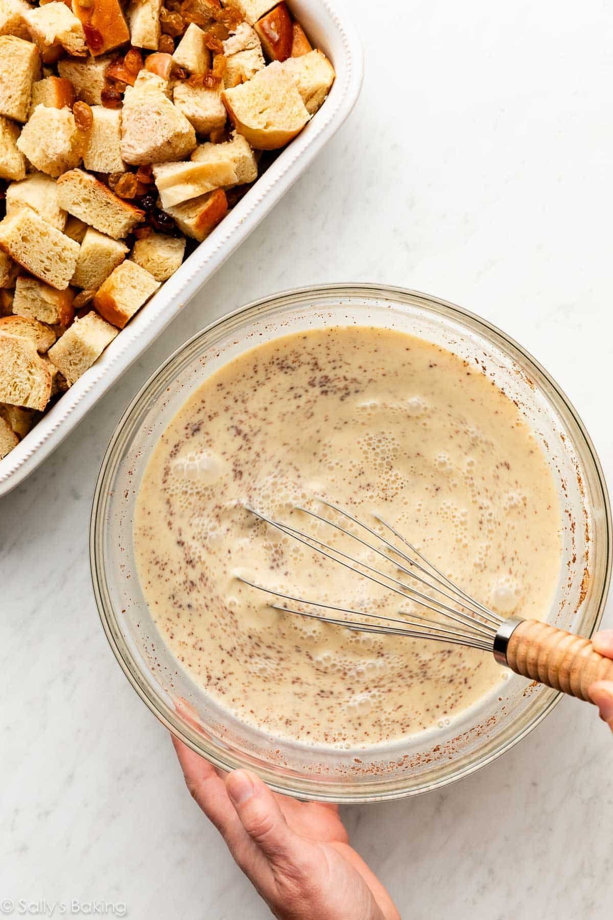 whisking egg mixture in bowl.