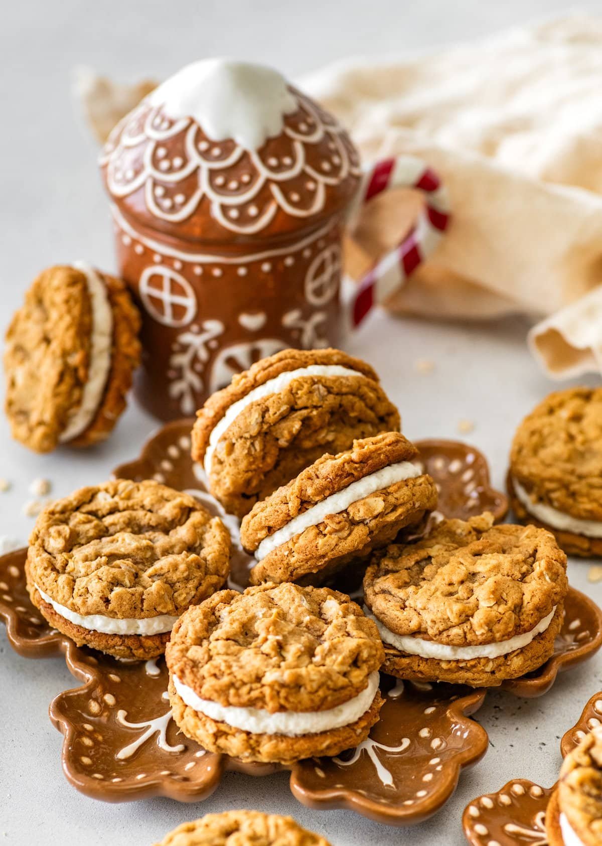 gingerbread oatmeal cream pies on brown snowflake plate. 