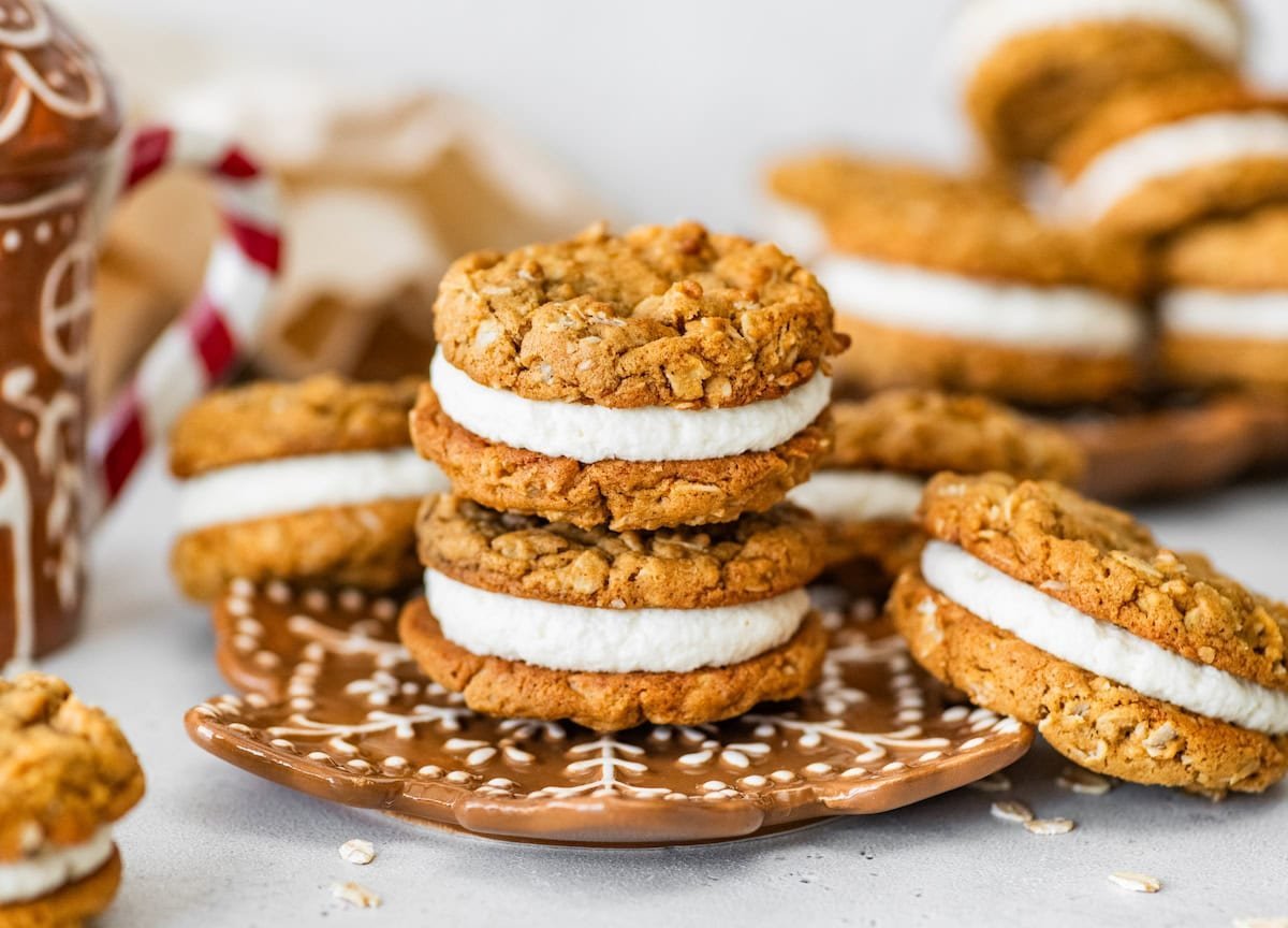 gingerbread oatmeal cream pies stacked on plate. 