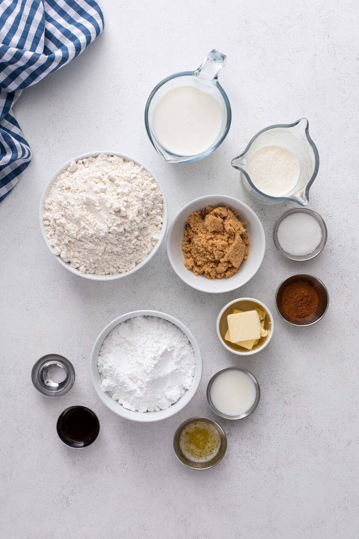 Biscuit cinnamon roll ingredients arranged on a countertop.
