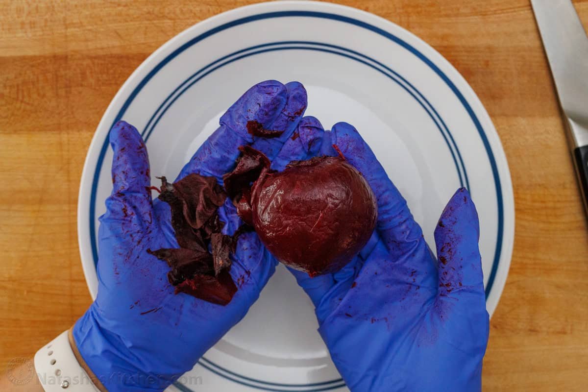 Citrus Salad looks so beautiful with fresh, colorful fruit and tastes amazing drizzled with sweetened lemon vinaigrette! Holiday-worthy dish. Peeling a roasted beet with gloves
