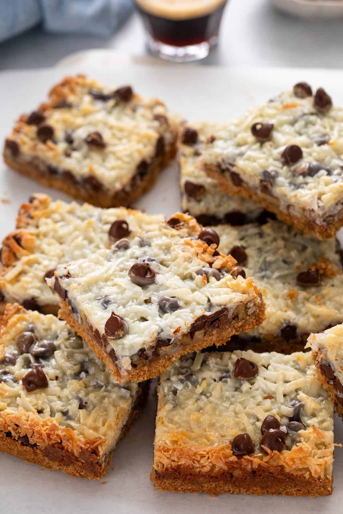 Magic bars cut into squares and arranged on a cutting board.