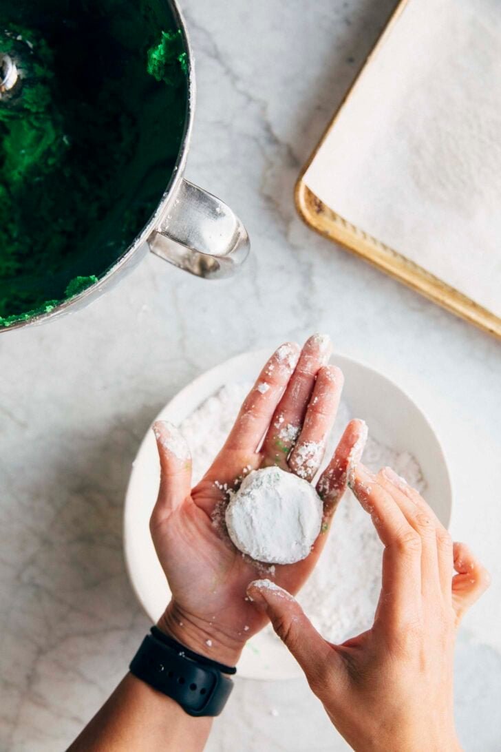 Photo of Michelle from Hummingbird High flattening the cookie dough ball