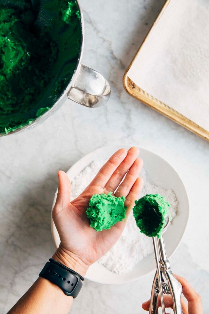 Photo of Michelle from Hummingbird High scooping pandan cookie dough into her hand