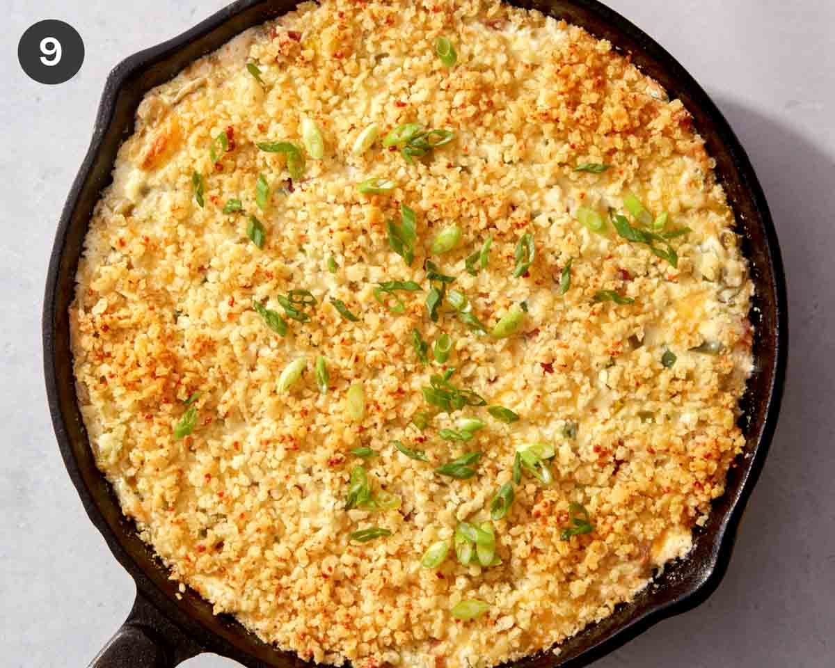 Finished jalapeño popper dip in a skillet ready to be served.