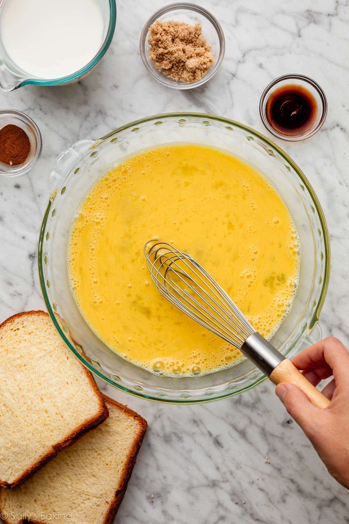 whisking eggs in pie dish.