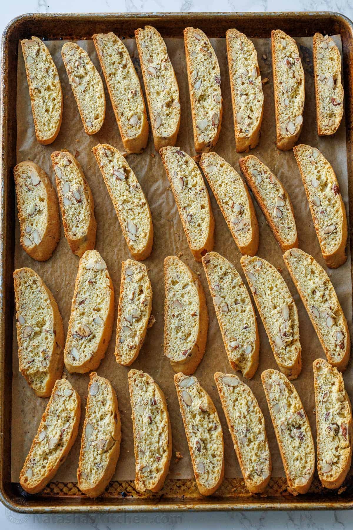 Biscotti recipe cookies in rows on a baking sheet