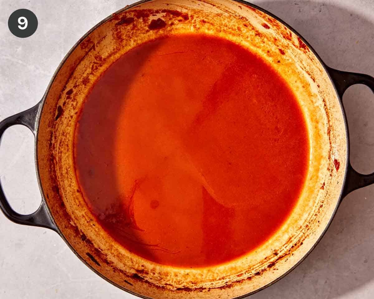 Short rib sauce simmering in a skillet.