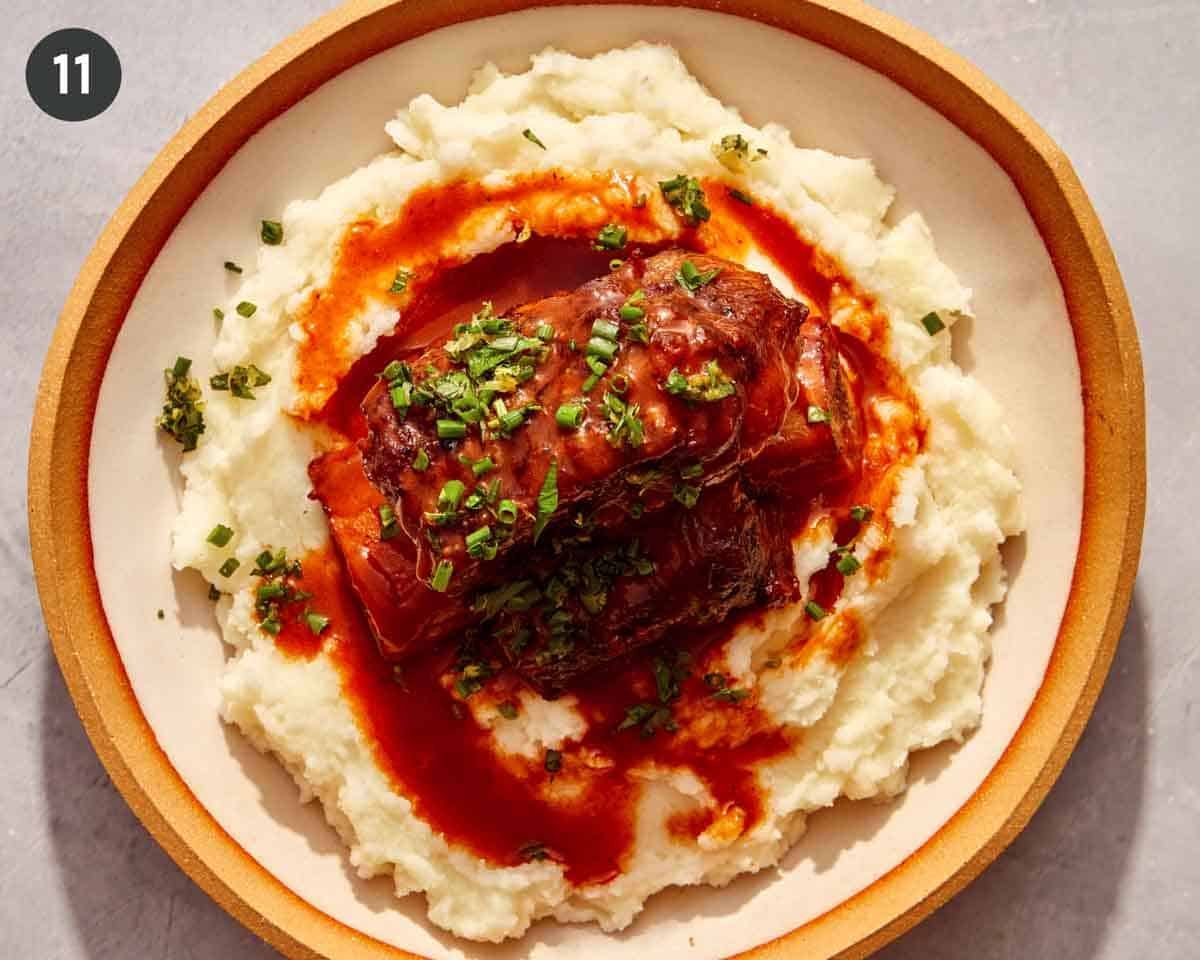 Braised short ribs plated with a gremolata.