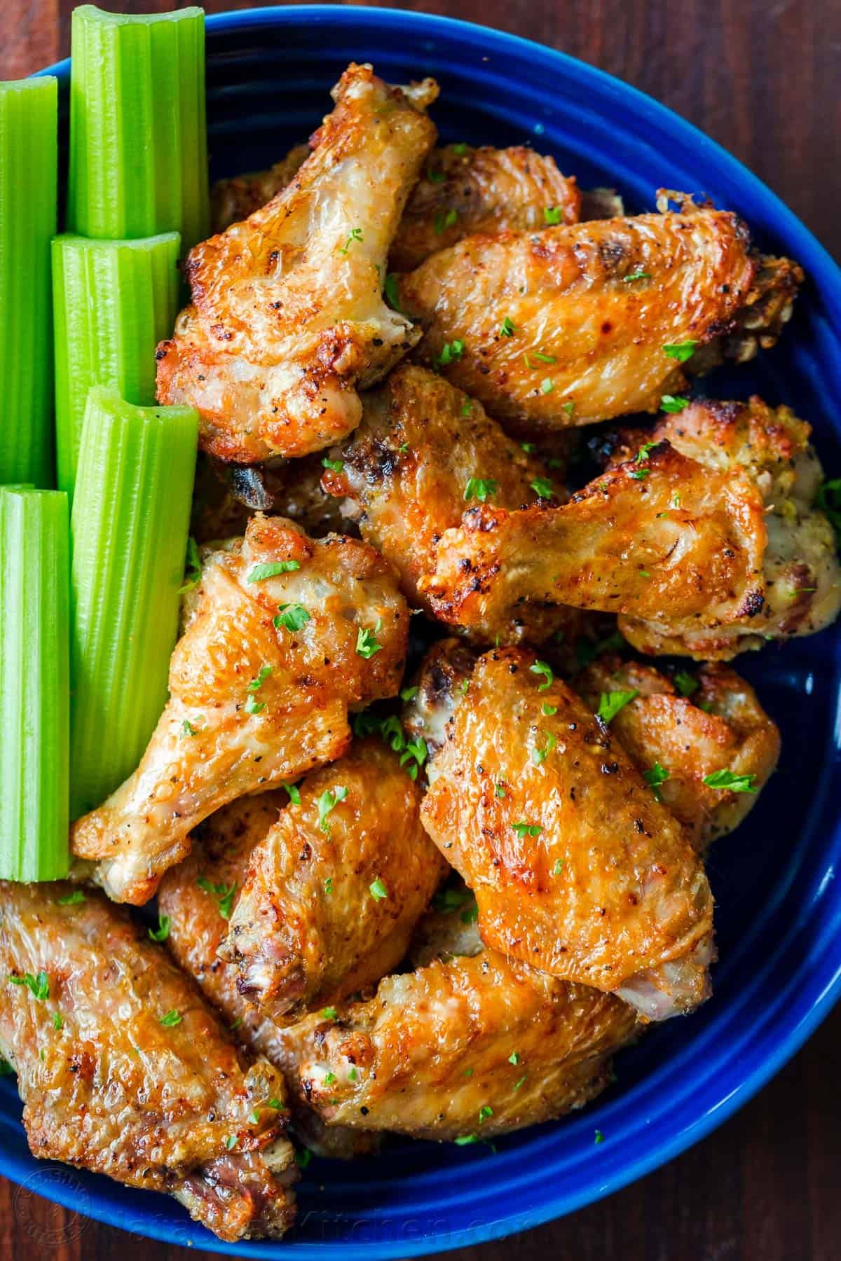 Air Fryer chicken wings in bowl with celery