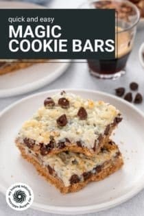 Two magic bars stacked on a white plate, with a bite taken from the corner of the top bar. Text overlay includes recipe name.