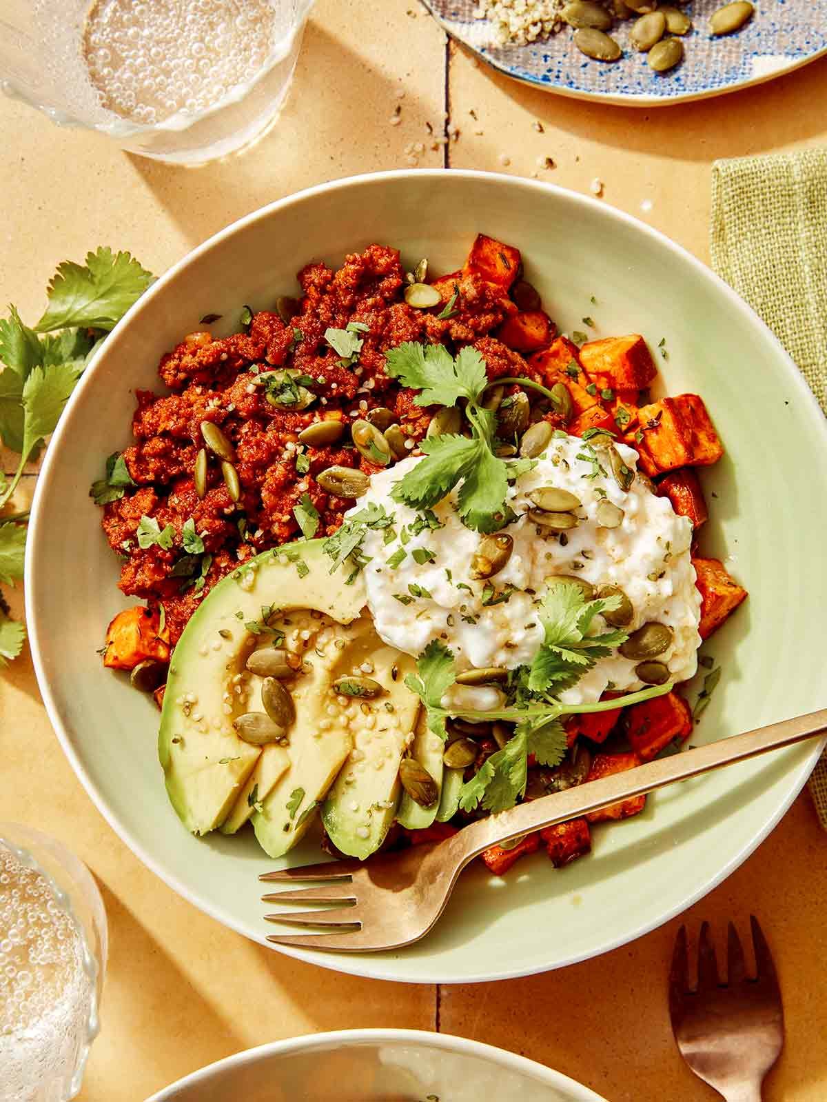 Beef protein bowl with some cilantro on the side.