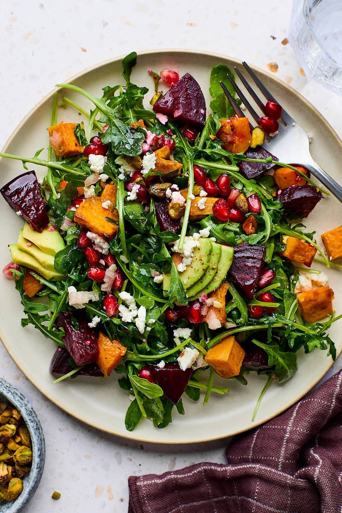 Roasted Sweet Potato and Beet Salad on plate with fork. 