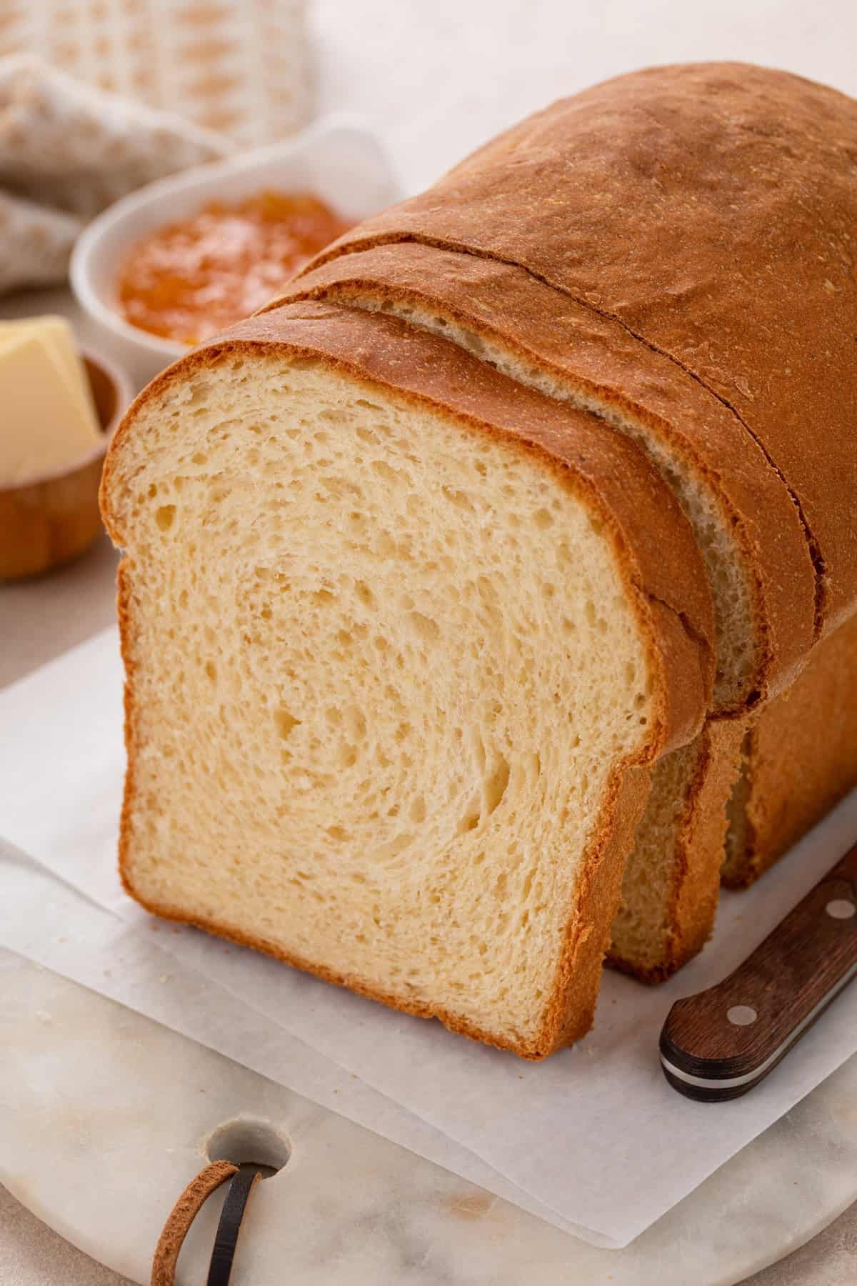 Cross section view of a slice of potato bread, showing the texture of the crumb.