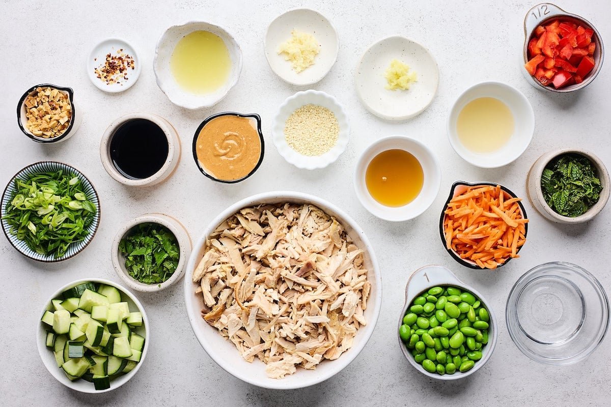 ingredients in bowls to make peanut chicken salad.