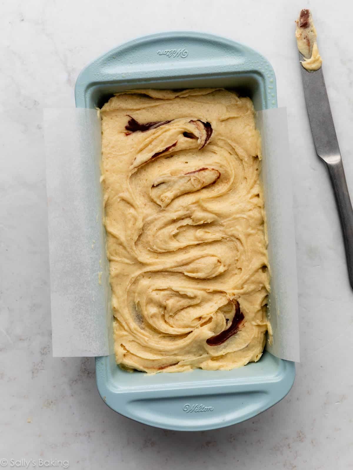 batter in blue loaf pan.