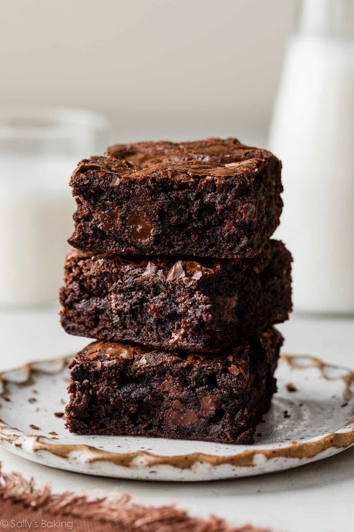 stack of brownies on plate.