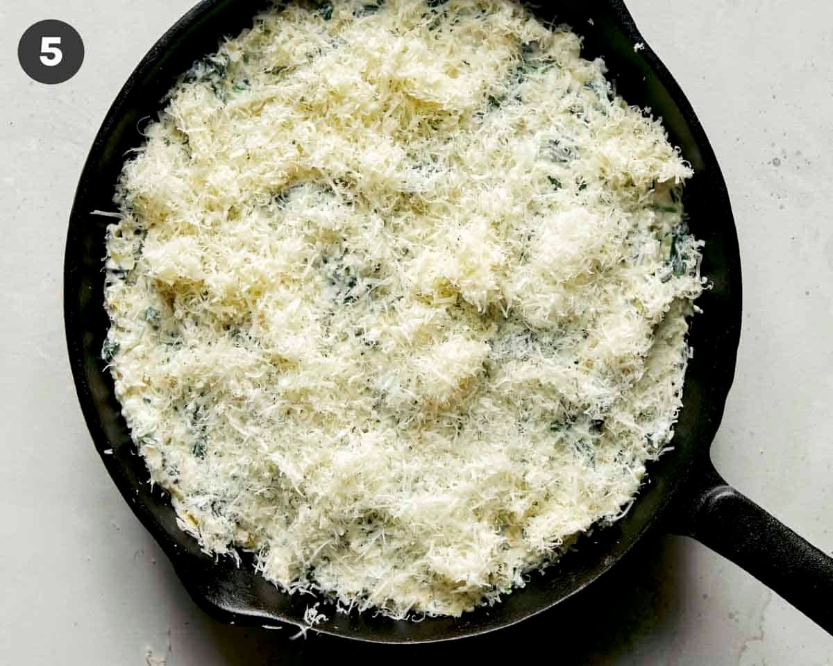 Spinach and artichoke dip topped with cheese.