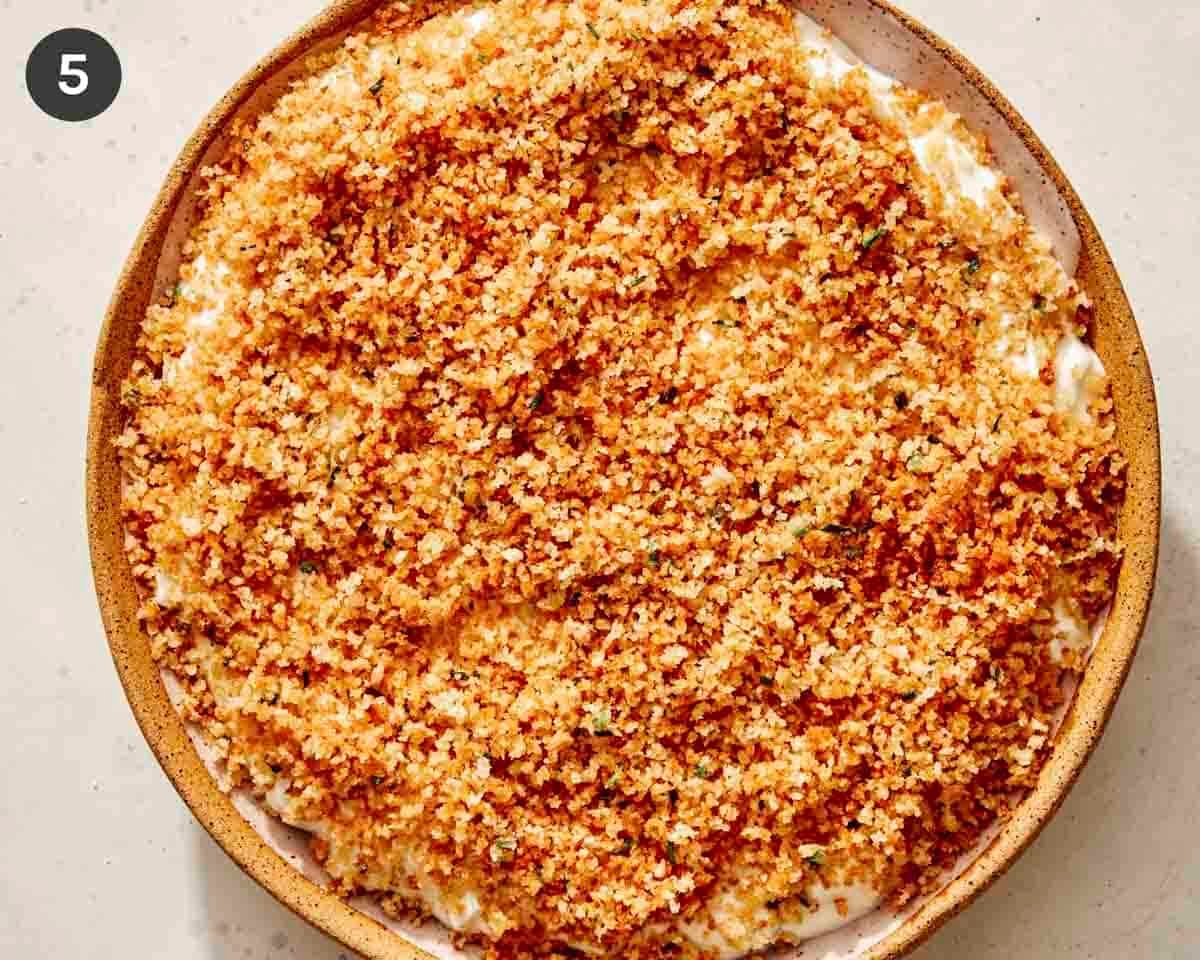 Fried pickle dip with the topping on it.