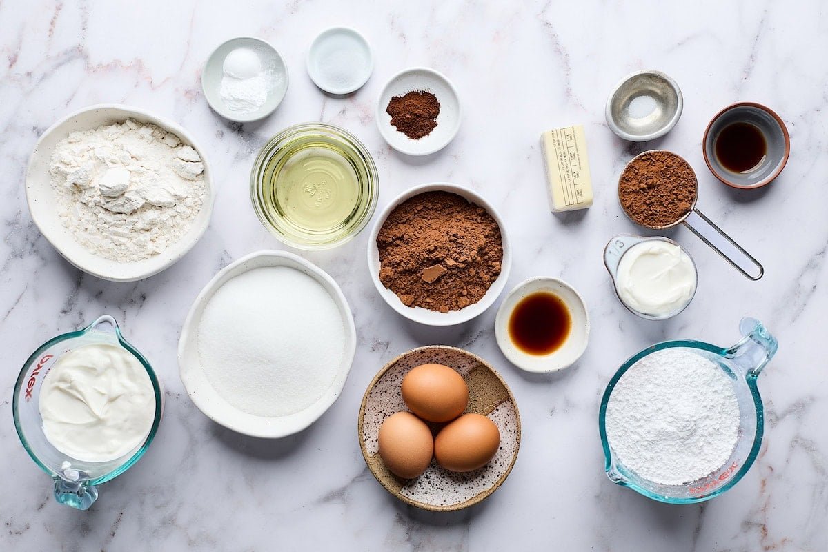 ingredients in bowls to make chocolate yogurt cake. 