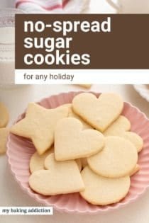 No-spread sugar cookies in assorted shapes arranged on a pink plate. Text overlay includes recipe name.