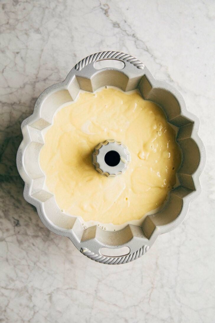 photo of the banana pudding bundt cake batter in the bundt pan before it's been baked